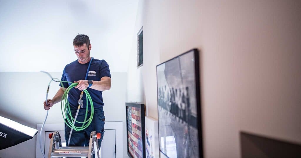 Dependable Duct Cleaning technician with truck-mounted vacuum system CT